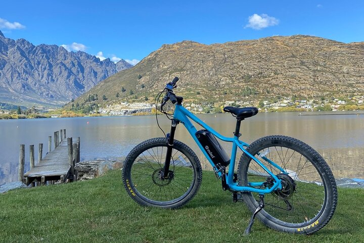Experience the stunning landscapes of Queenstown on an e-mountain bike. Pedal alongside serene waters and majestic mountains for an unforgettable adventure just minutes from the airport.